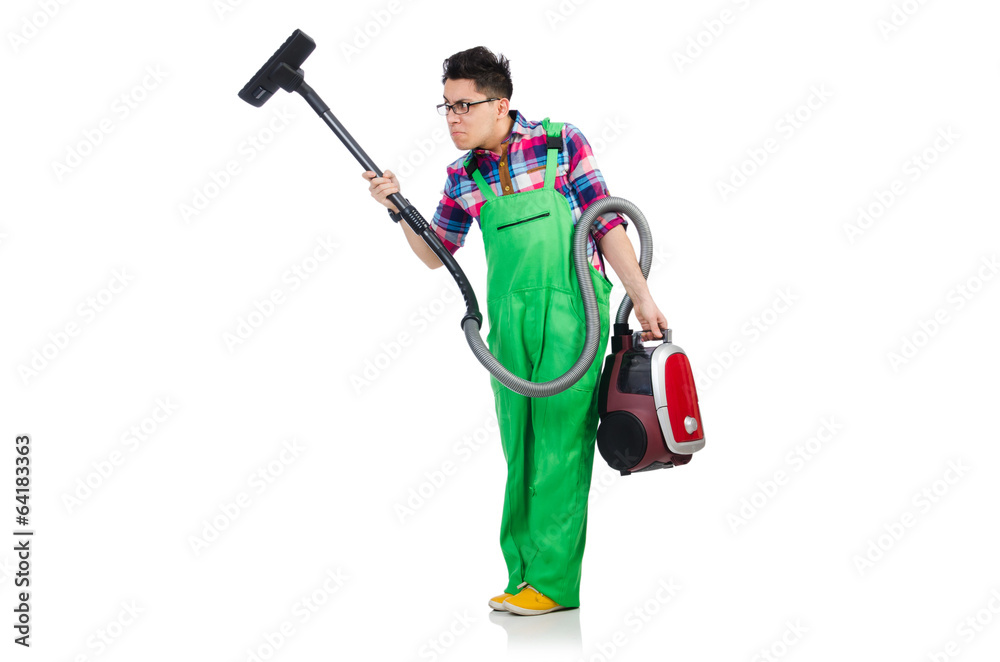 Funny man in green coveralls vacuum cleaning Funny man in green coveralls vacuum cleaning