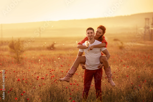 Couple in the poppy field