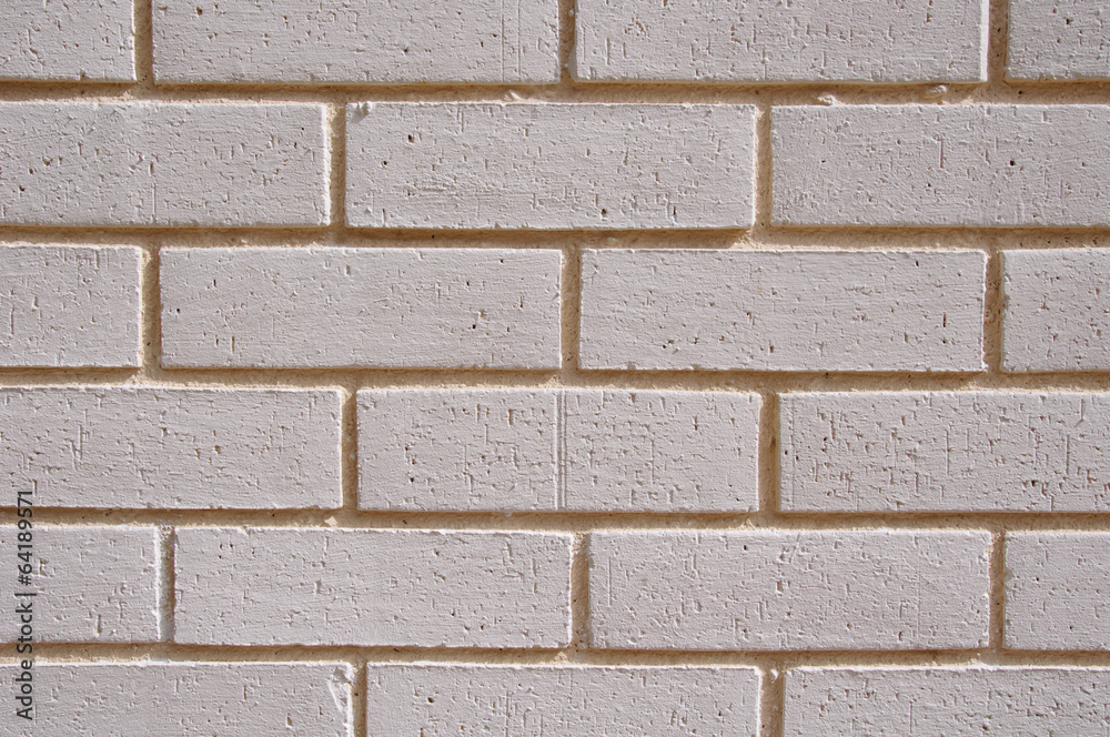 Naklejka premium Wall of white bricks with yellow fugue