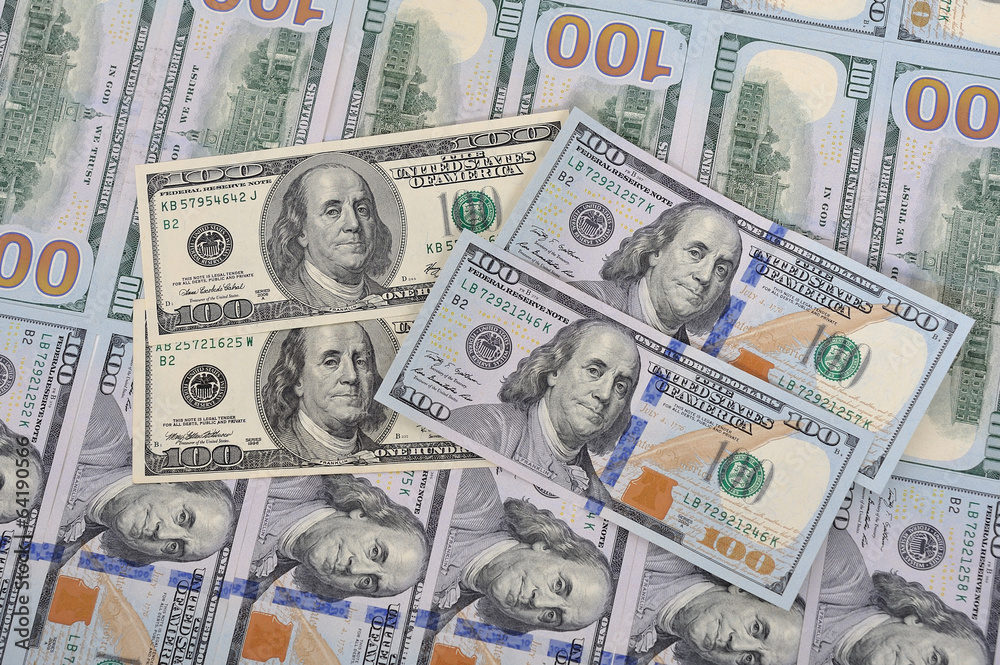 New and old banknotes on a background of hundred dollars New and old banknotes on a background of hundred dollars