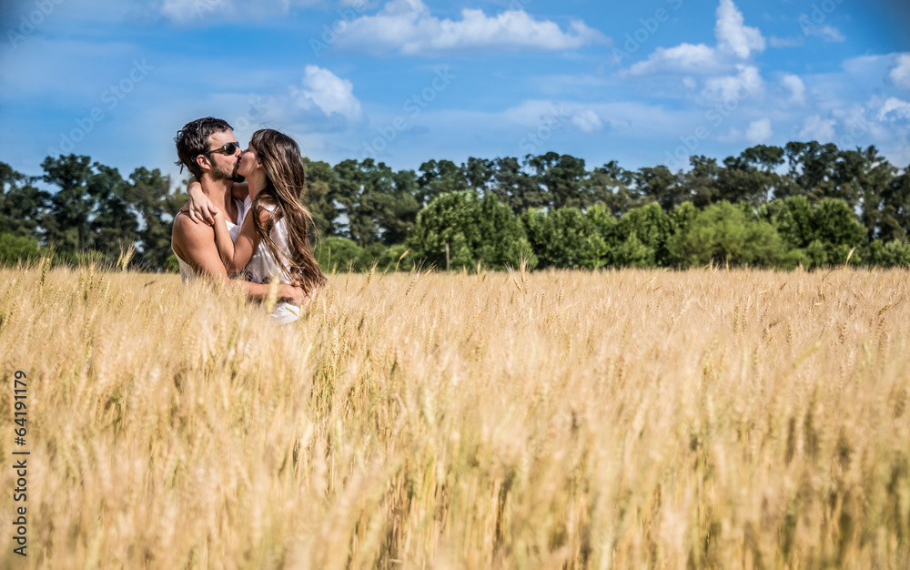 Couple in love kissing in argentinean countryside fields. Couple in love kissing in argentinean countryside fields.