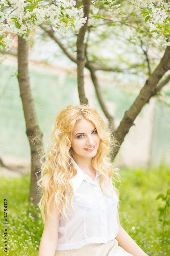 Spring portrait of a beautiful young blonde