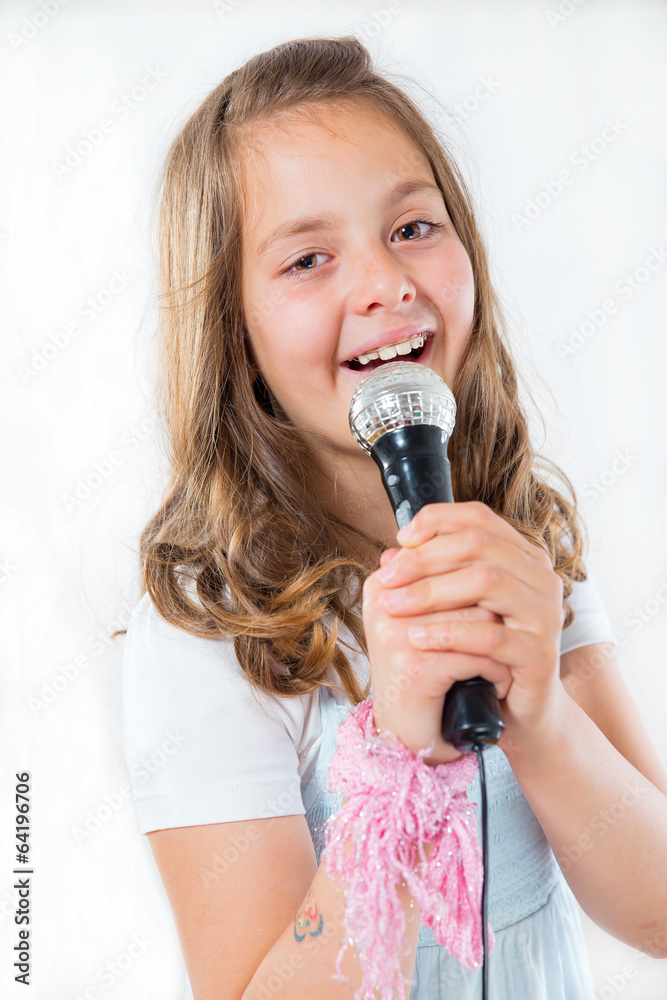 Pretty little girl singing in microphone Pretty little girl singing in microphone