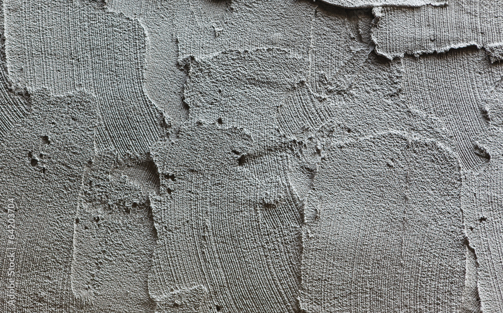 plasterer concrete worker at wall of house construction