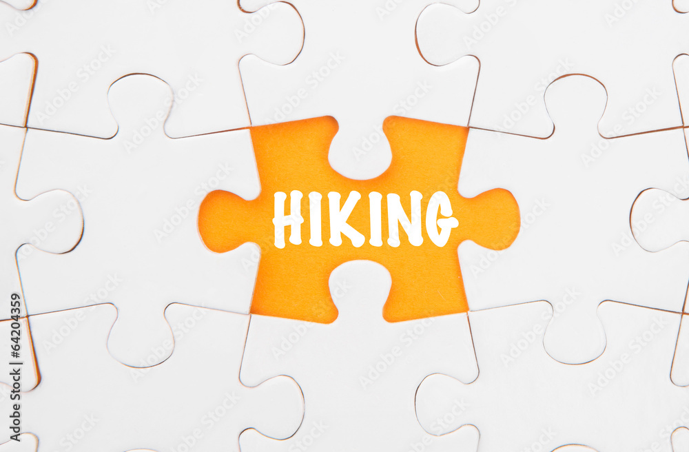 Missing piece of jigsaw puzzle revealing the HIKING words Missing piece of jigsaw puzzle revealing the HIKING words