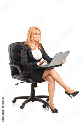 Mature businesswoman working on laptop
