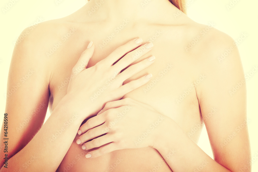Beautiful caucasian naked woman covering her chest. Beautiful caucasian naked woman covering her chest.