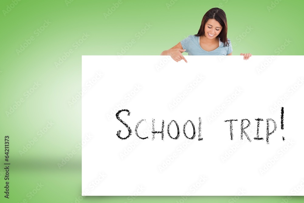 Pretty brunette showing card with school trip Pretty brunette showing card with school trip
