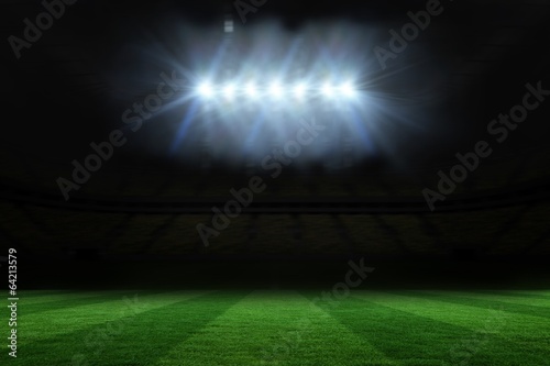 Football pitch under spotlights © WavebreakmediaMicro