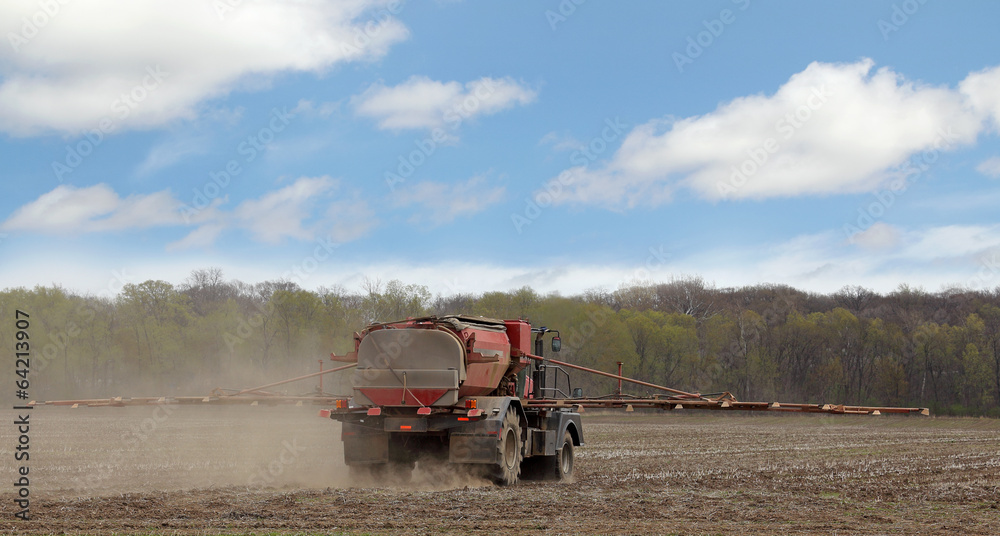 Fototapeta premium Spraying Farm Field
