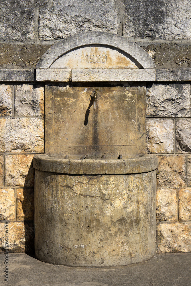 Public fountain from 1929 in Lozisca on Brac island, Croatia