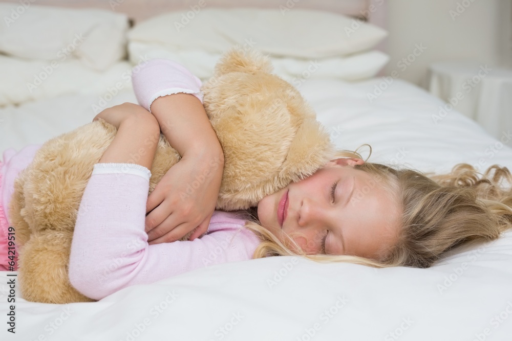 Young girl sleeping with stuffed toy in bed Young girl sleeping with stuffed toy in bed