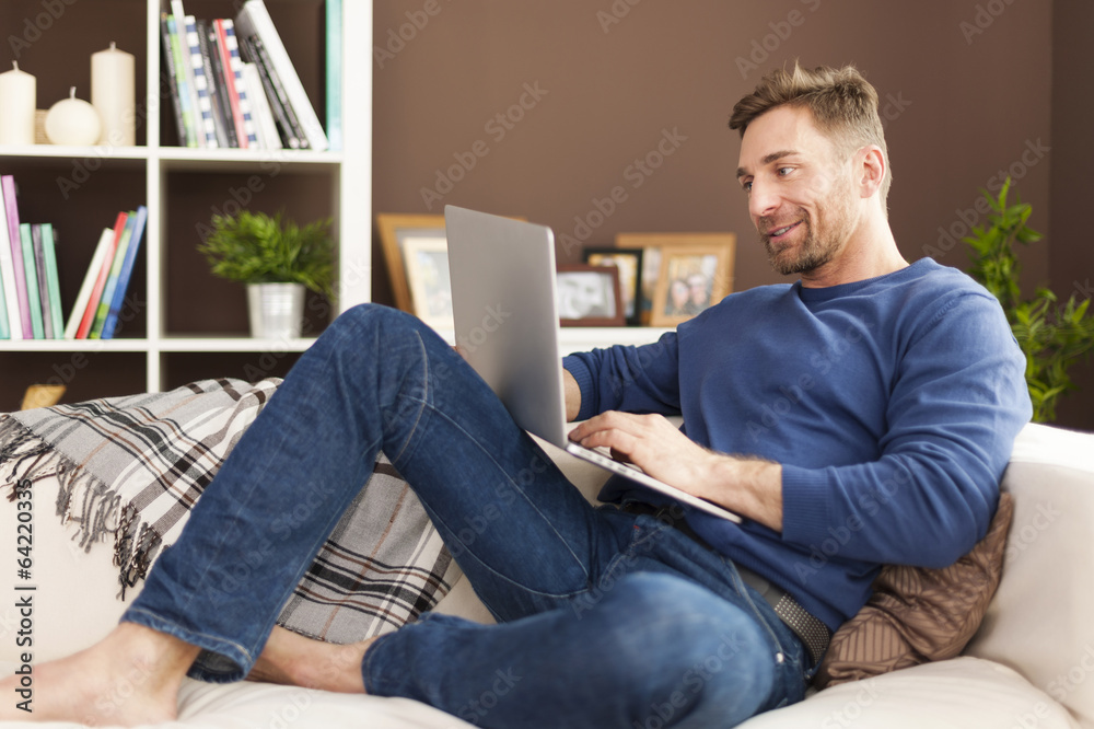 Man enjoying the modern technology at home