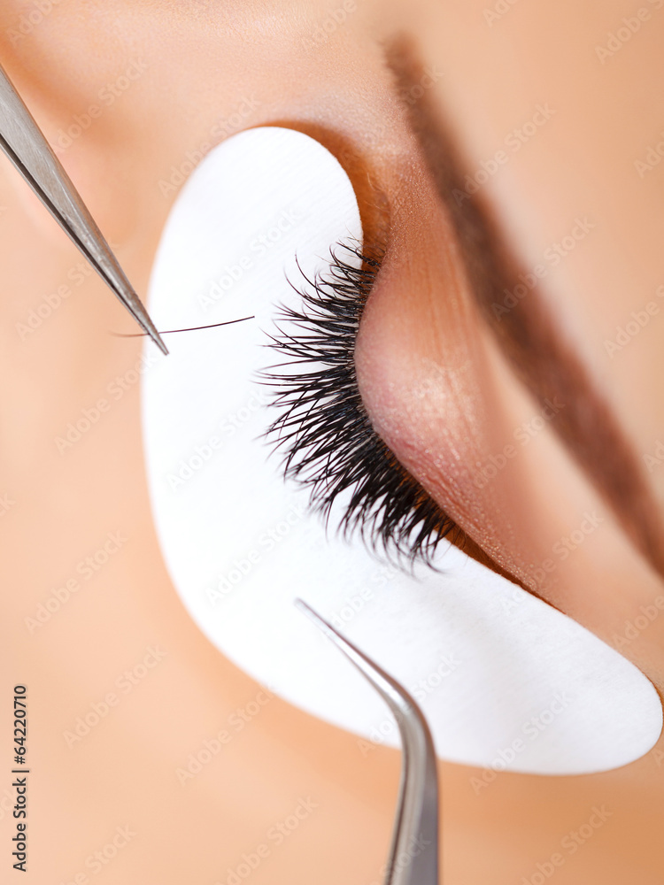 Naklejka premium Woman Eye with Long Eyelashes. Eyelash Extension