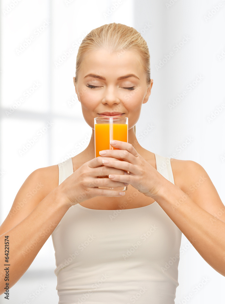 young woman drinking orange juice young woman drinking orange juice