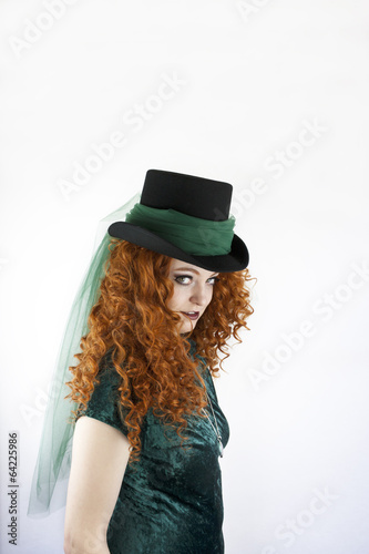 Irish woman with red hair wearing a hat