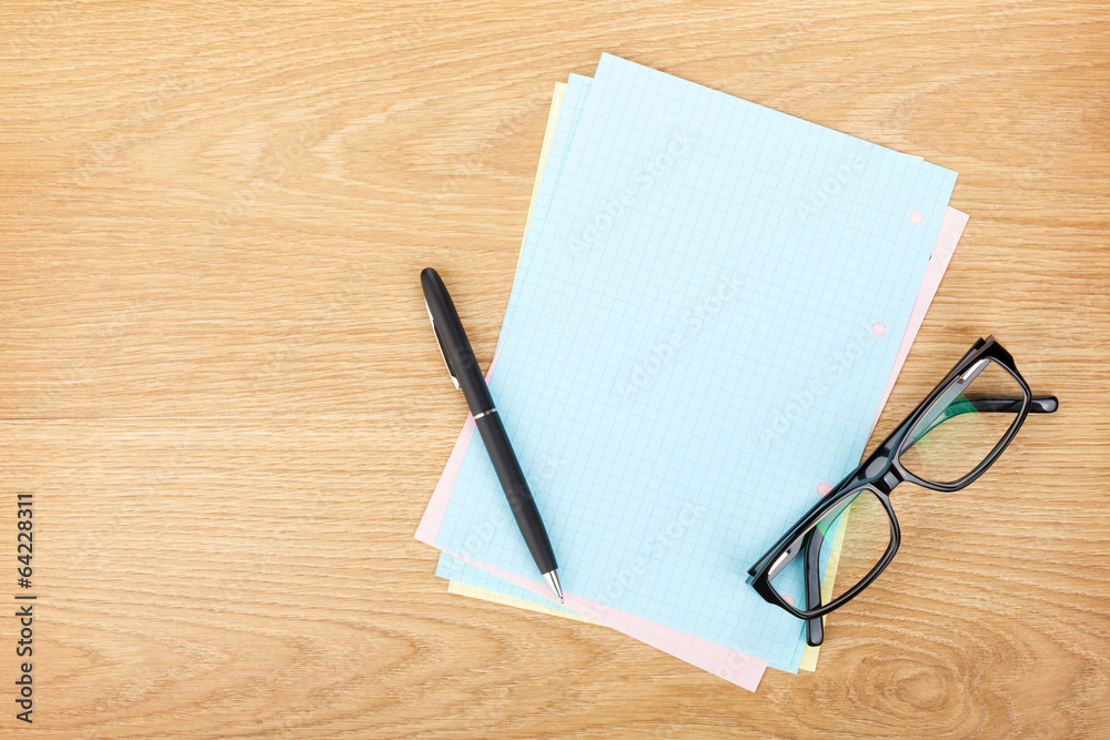 Blank lined paper with office supplies and glasses Blank lined paper with office supplies and glasses