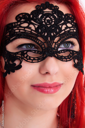 Young plump red-haired woman with mask