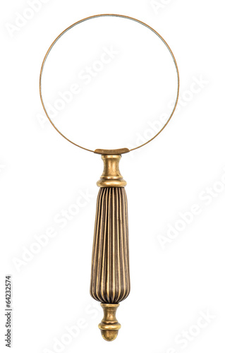 Antique magnifying glass isolated on white