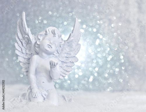 little white guardian angel in snow