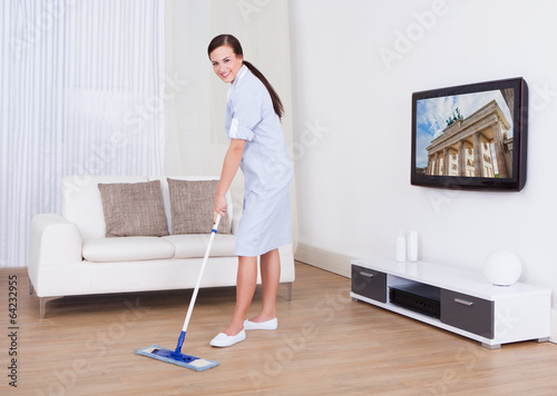 Maid Cleaning Floor With Mop