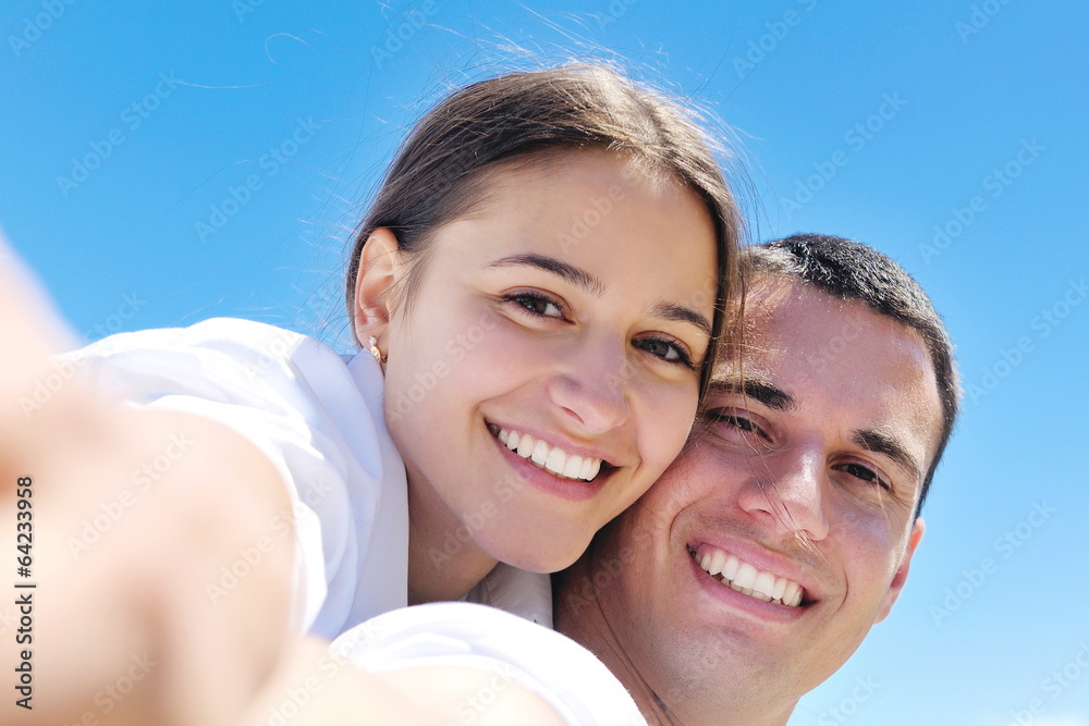 happy couple have fun on the beach happy couple have fun on the beach