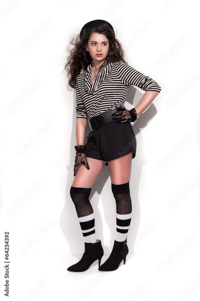 Bold eighties fashion girl in black and white. Studio shot again Bold eighties fashion girl in black and white. Studio shot again