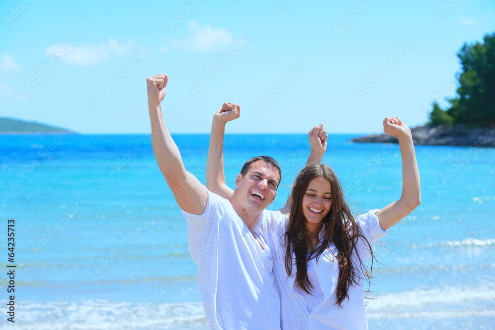 happy couple have fun on the beach happy couple have fun on the beach