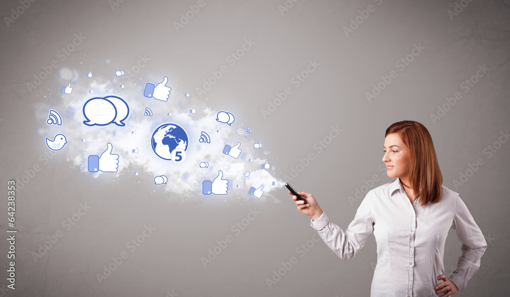 Pretty young girl holding a phone with social media icons Pretty young girl holding a phone with social media icons
