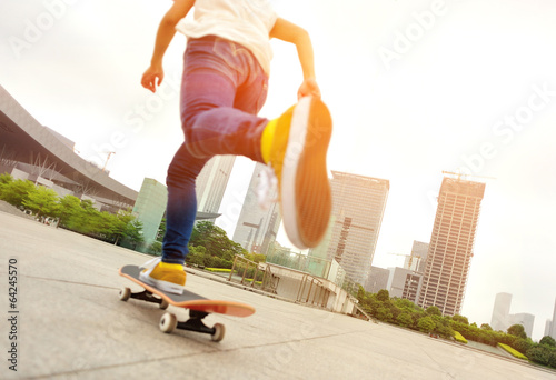 skateboarding woman at city