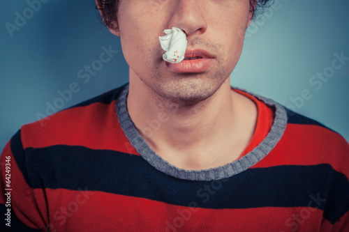 Quadro su tela Man with nose bleed and cold sores
