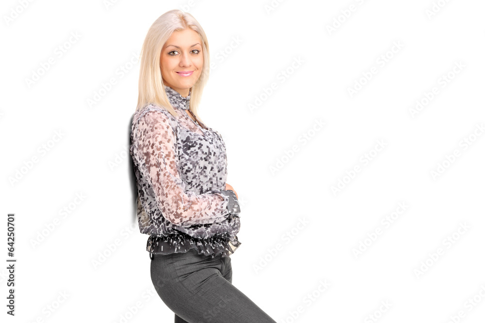 Smiling female leaning against wall Smiling female leaning against wall