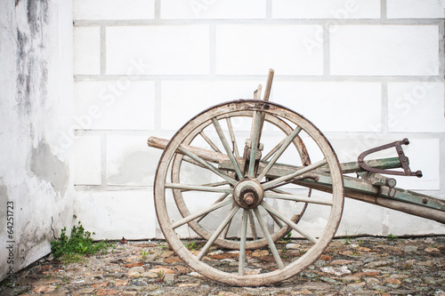 Vintage Old Wooden Ploughe with Renaissance Sgrafito Wall photo