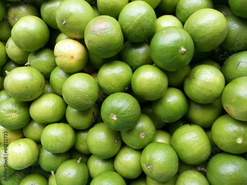 Fresh green Lemons background