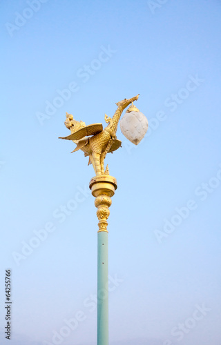 Bird statue on light pole The sky background