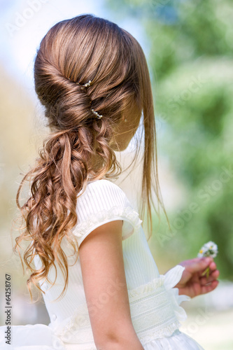 Detail of girl's communion hairstyle.