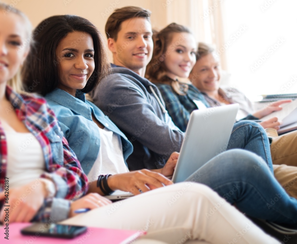 Group of students preparing for exams in apartment interior Group of students preparing for exams in apartment interior