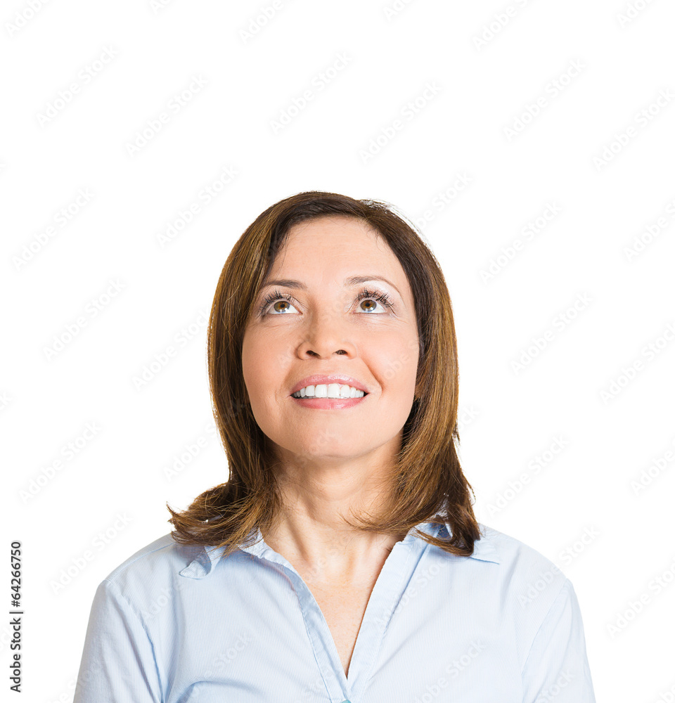 Look up. Happy middle aged woman looking up, white background Look up. Happy middle aged woman looking up, white background