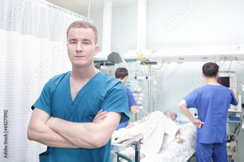 Young doctor man on a background of a hospital ward