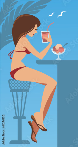 The hot summer, beautiful girl in bikini drinking the cocktail