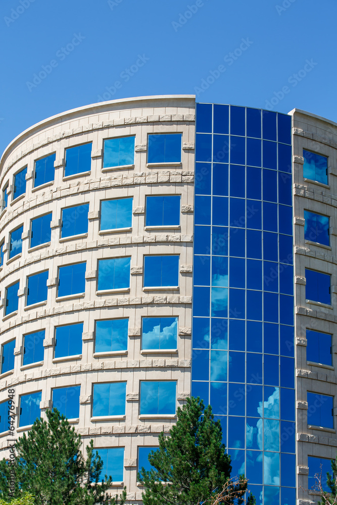 Curved Stone and Blue Glass Office Tower