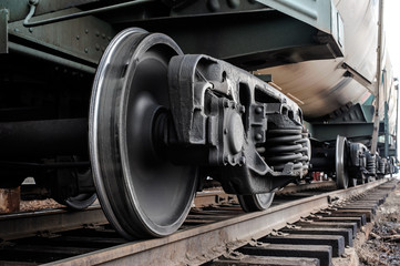 Fotobehang Trein Spoorwielen van locomotief in detail  © Sergey Bogdanov