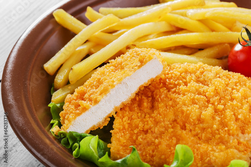 breaded chicken schnitzel fries