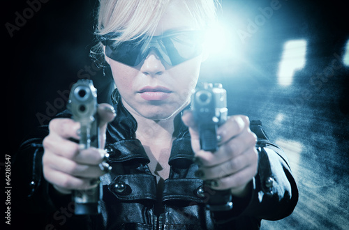 Tablou pe pânză Beautiful sexy girl with gun