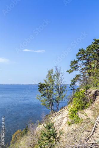 romantic steep cliff with lake
