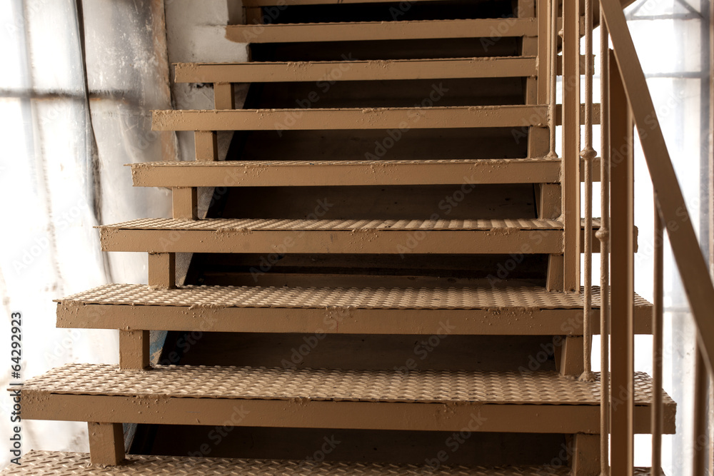 metal ladder in a building. metal ladder in a building.