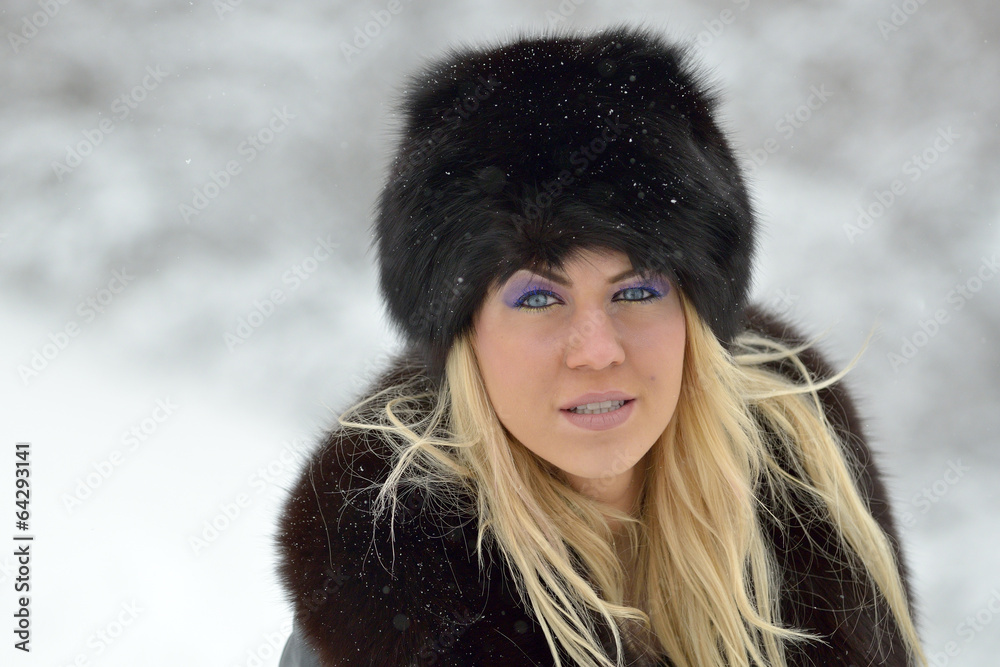 Smiling woman portrait outdoor in winter Smiling woman portrait outdoor in winter