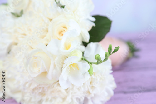 Beautiful wedding bouquet on table on bright background