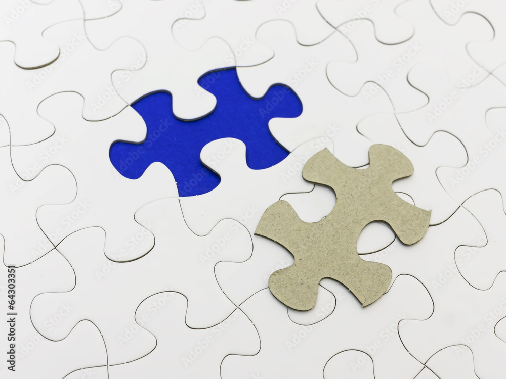 Missing piece of white puzzle and reveal blue color. Missing piece of white puzzle and reveal blue color.