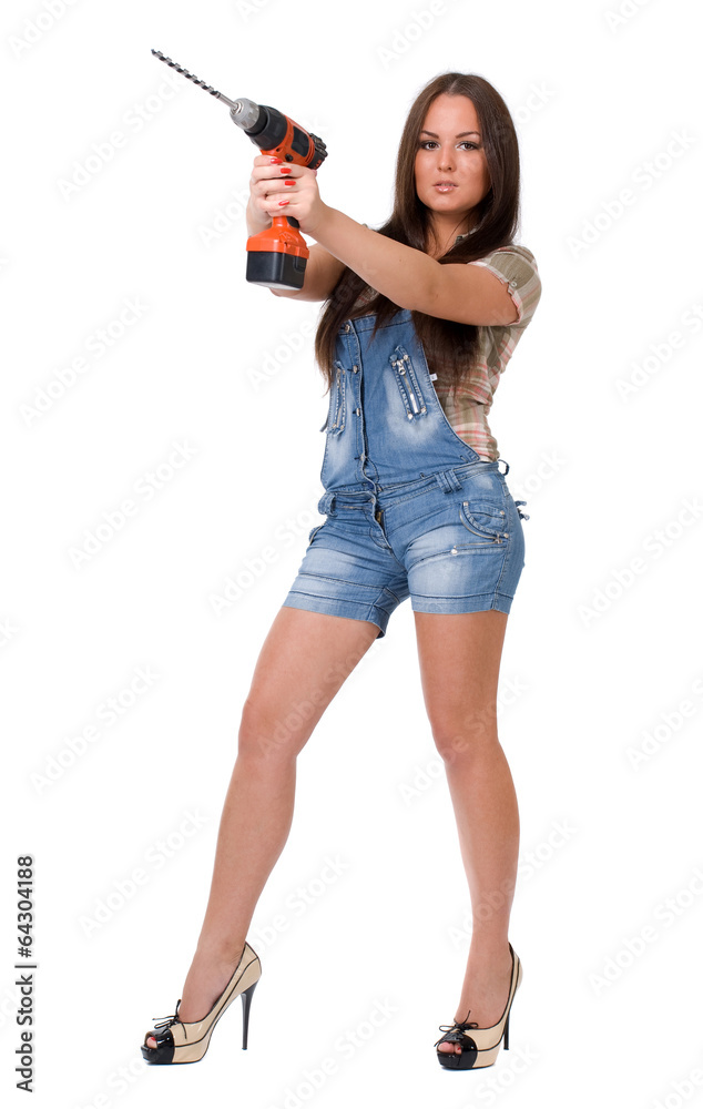 Young woman holding a cordless electric drill. Isolated on white Young woman holding a cordless electric drill. Isolated on white